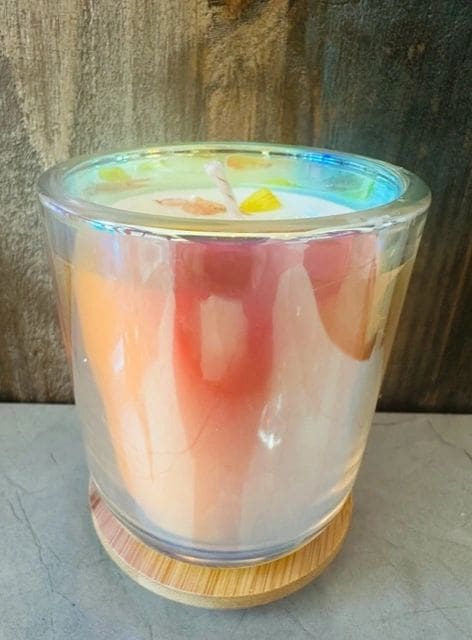 A candle in a glass on top of a table.